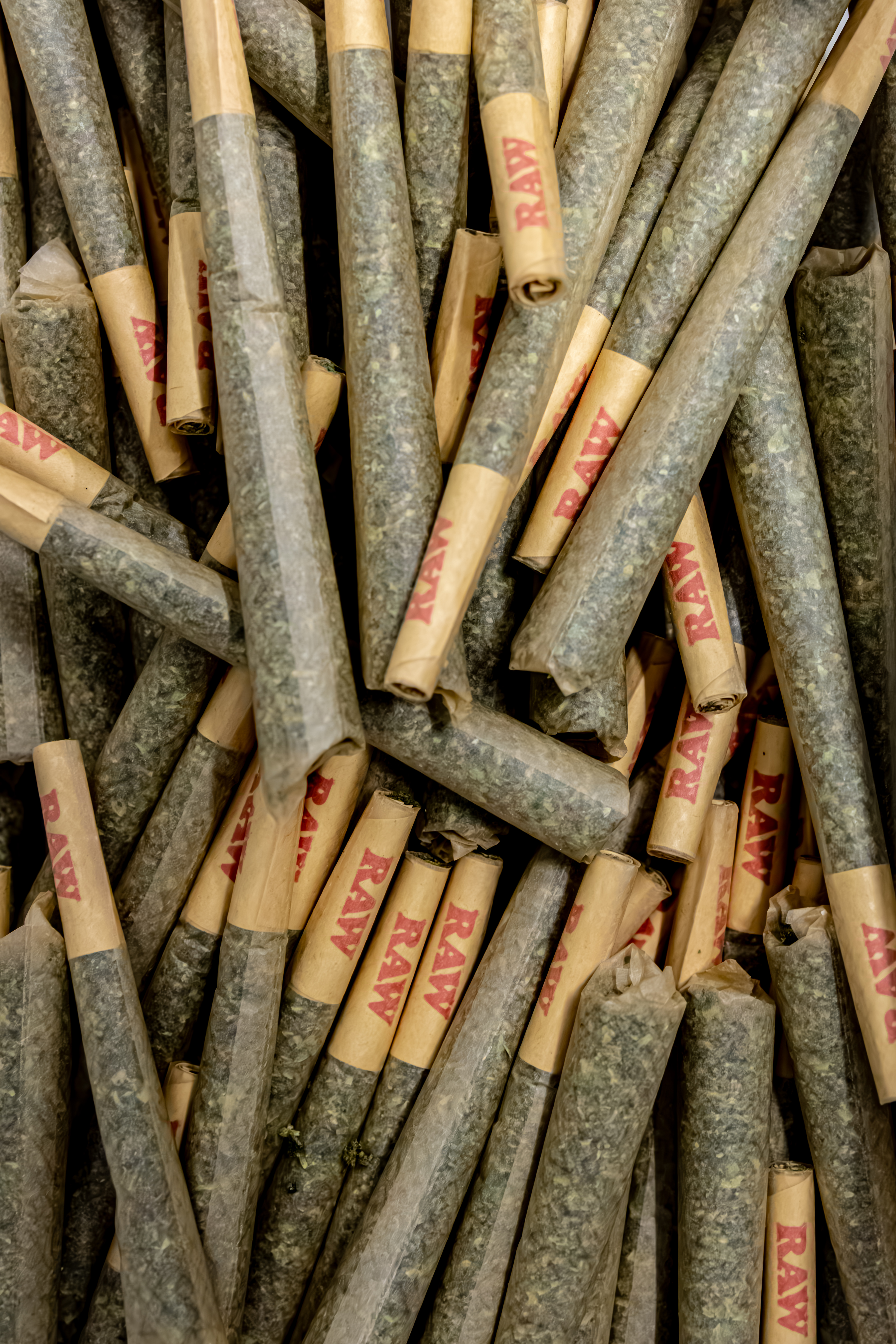 Pile of Royal Rush prerolls ready for packaging